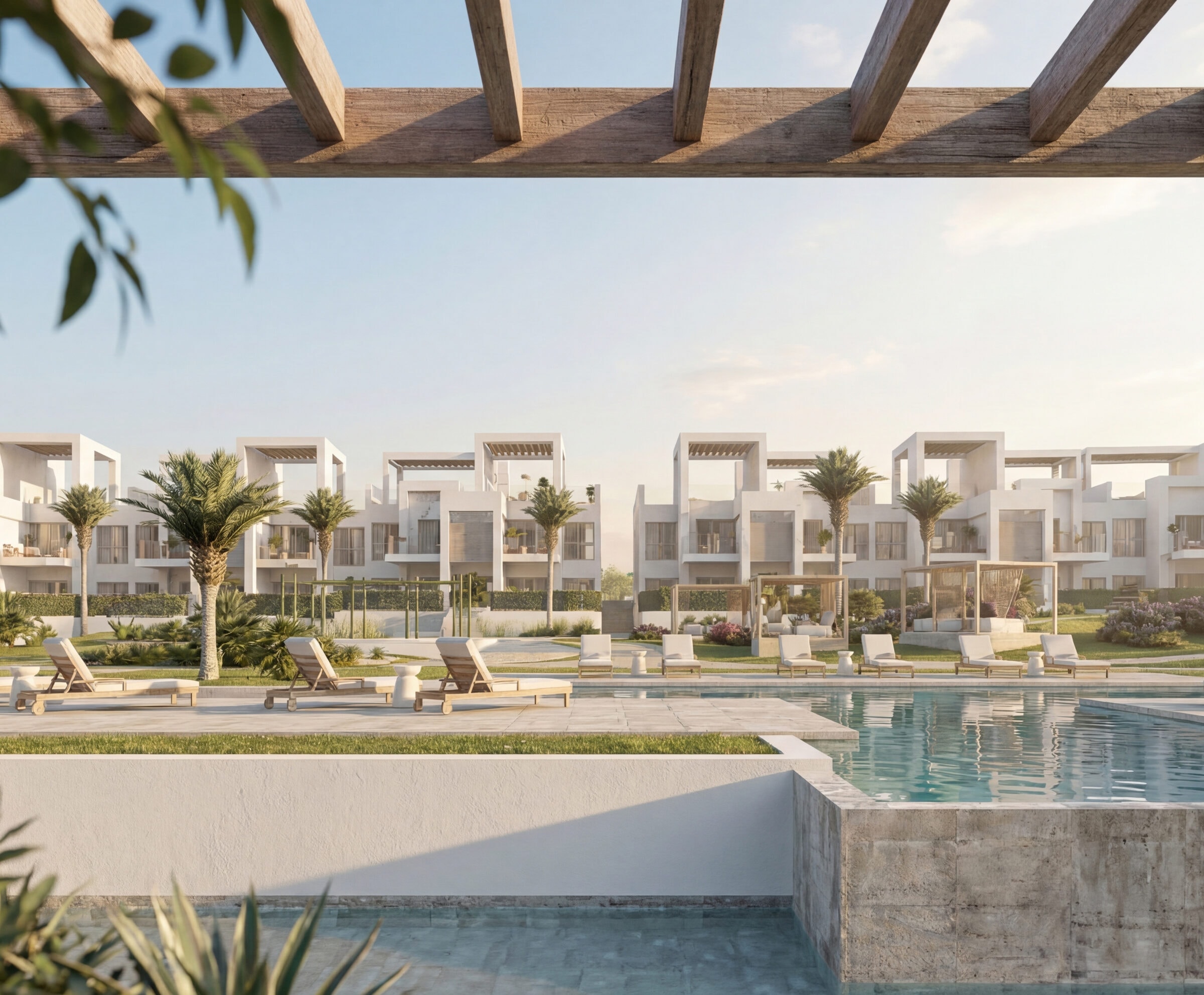 Het terras onder de pergola met uitzicht op het zwembad